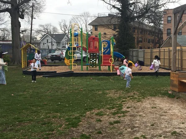 Children searching the church lawn during the Easter Egg Hunt in 2018
